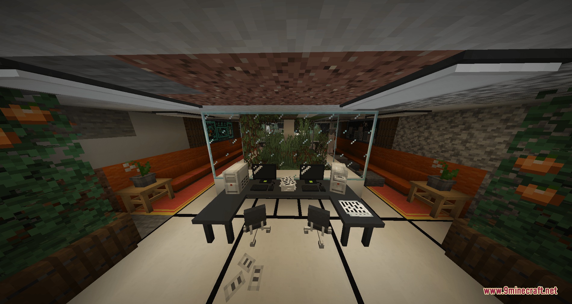 A modern underground office interior with computer desks and glass partition walls