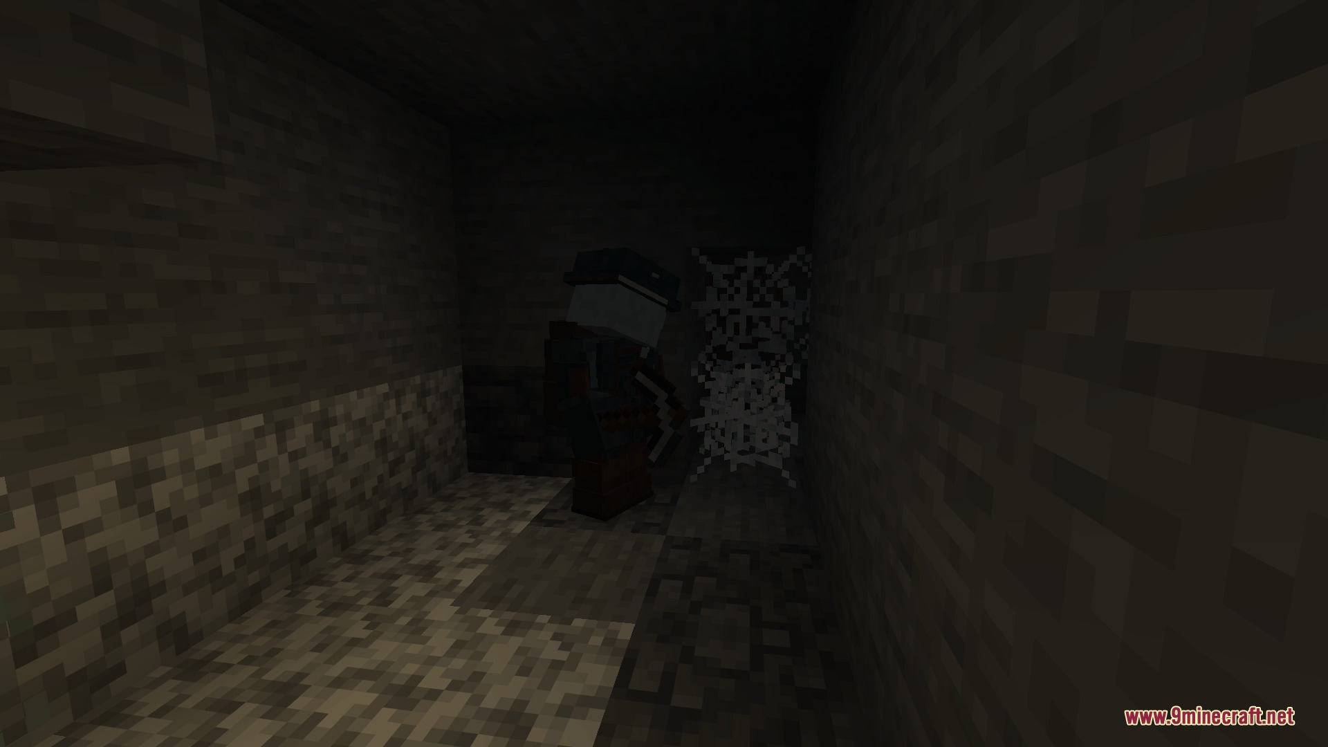 Ghostworks Mod Screenshot 5 A mysterious figure stands in a dark stone tunnel next to cobwebs