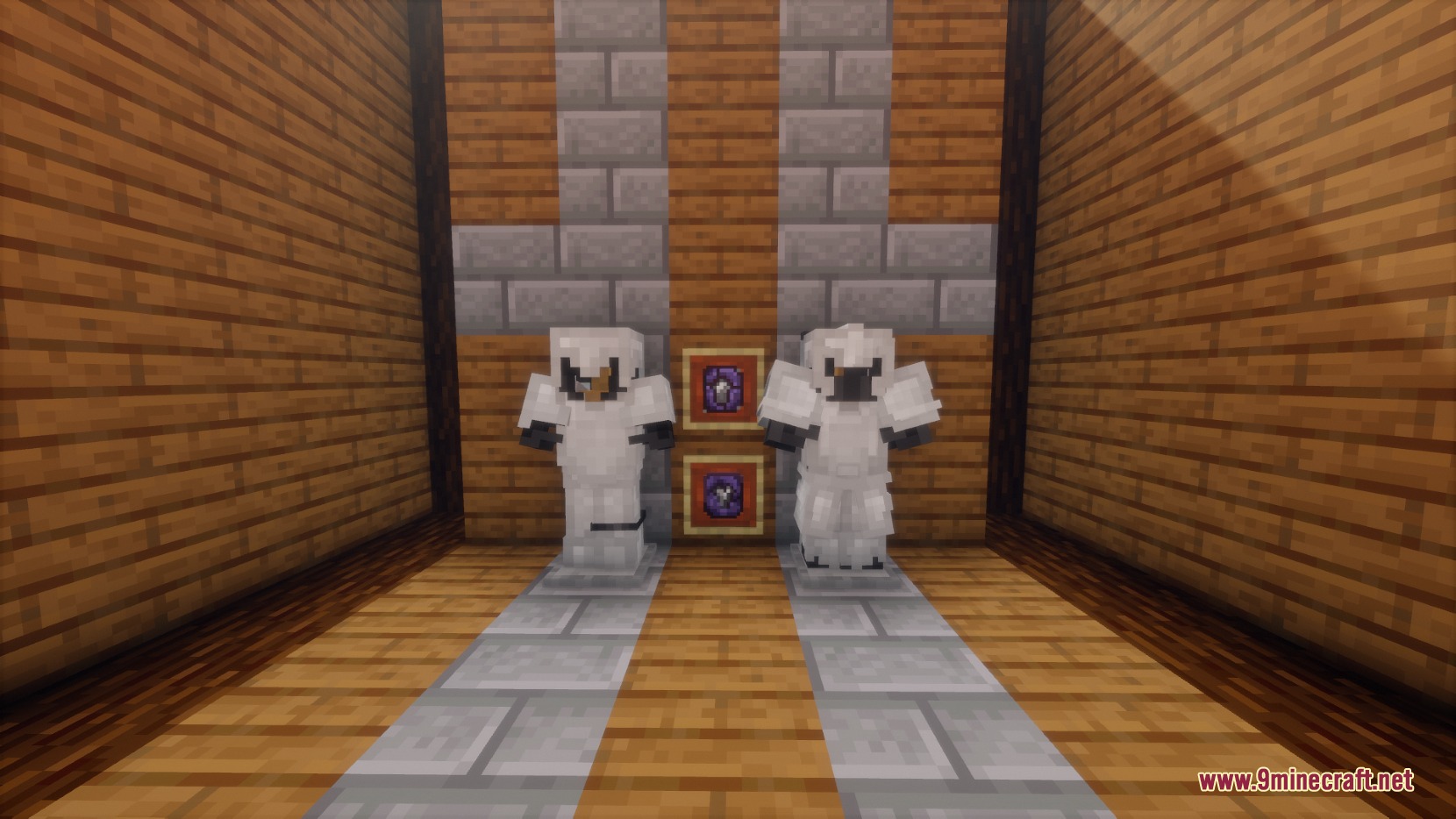Two sets of reinforced iron armor displayed on stands in a room