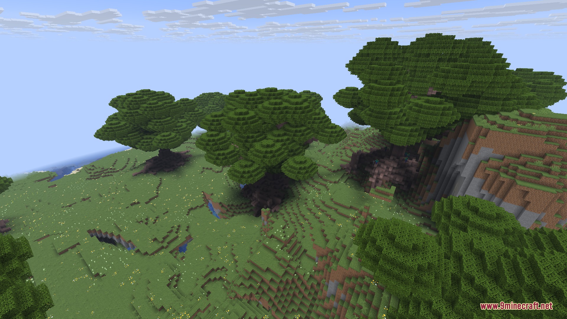 Gilded Orchard Harvest Mod Screenshot 2 Large custom apple trees growing in a lush green biome under a clear sky