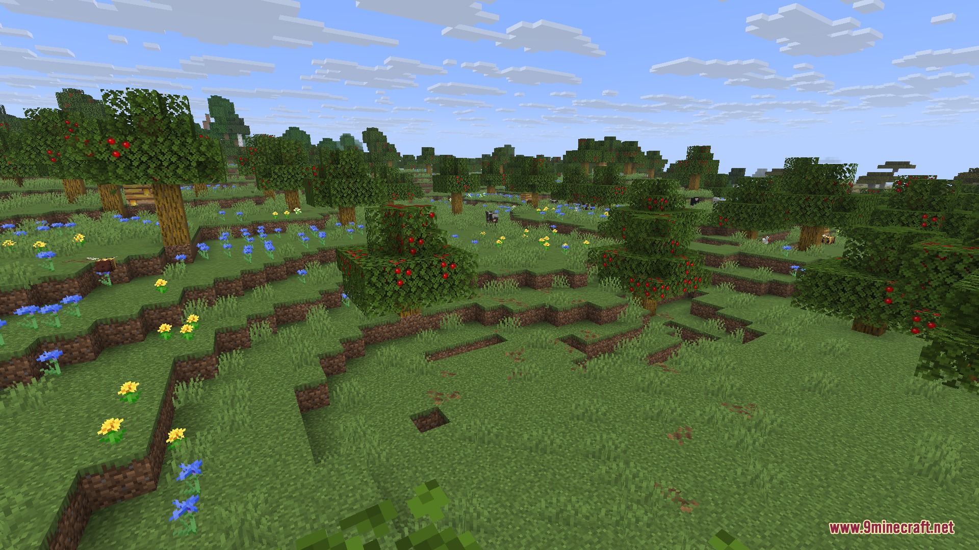 Gilded Orchard Harvest Mod Screenshot 3 Lush rolling hills in the Apple Grove biome filled with fruit trees