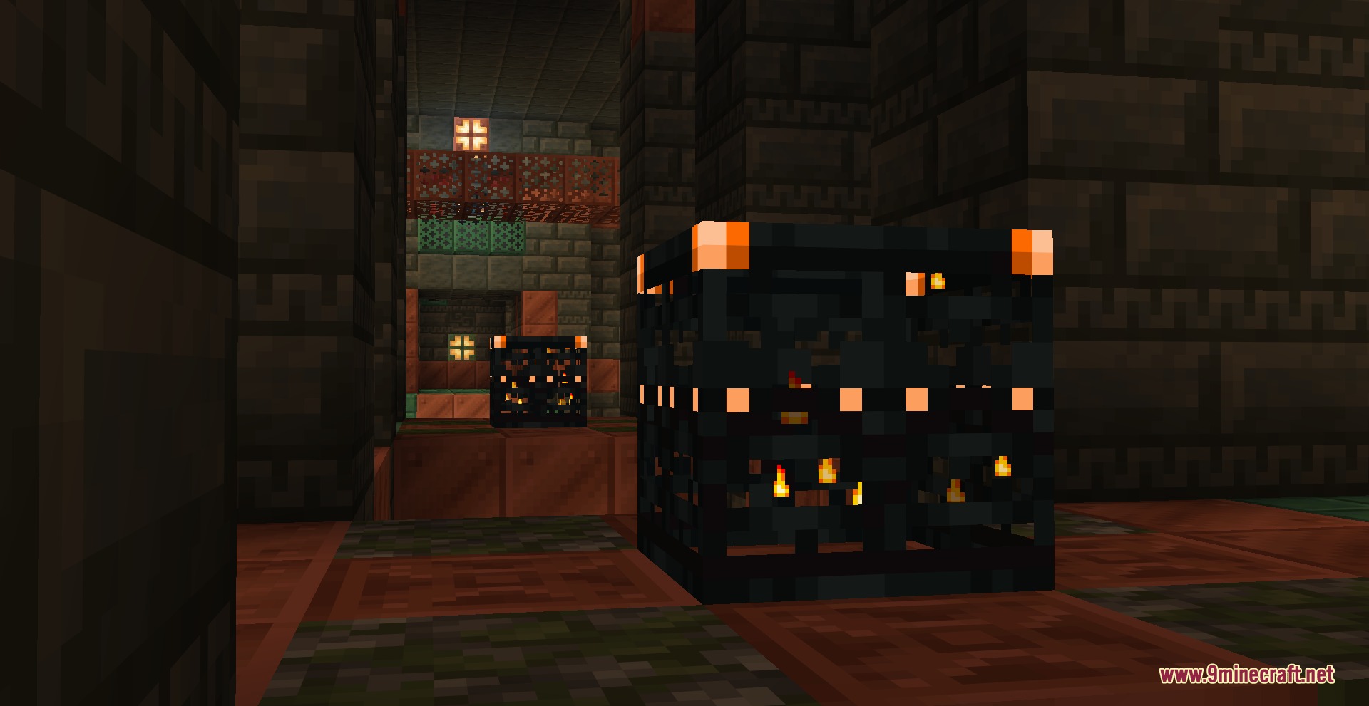 Trial spawners emitting a bright orange glow within a dark underground chamber