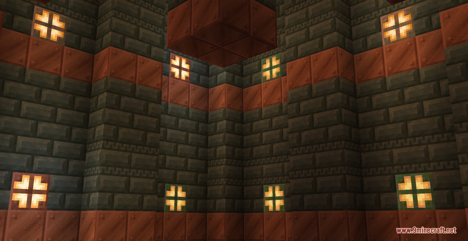 Bright copper bulbs illuminate the walls of a dark underground trial chamber