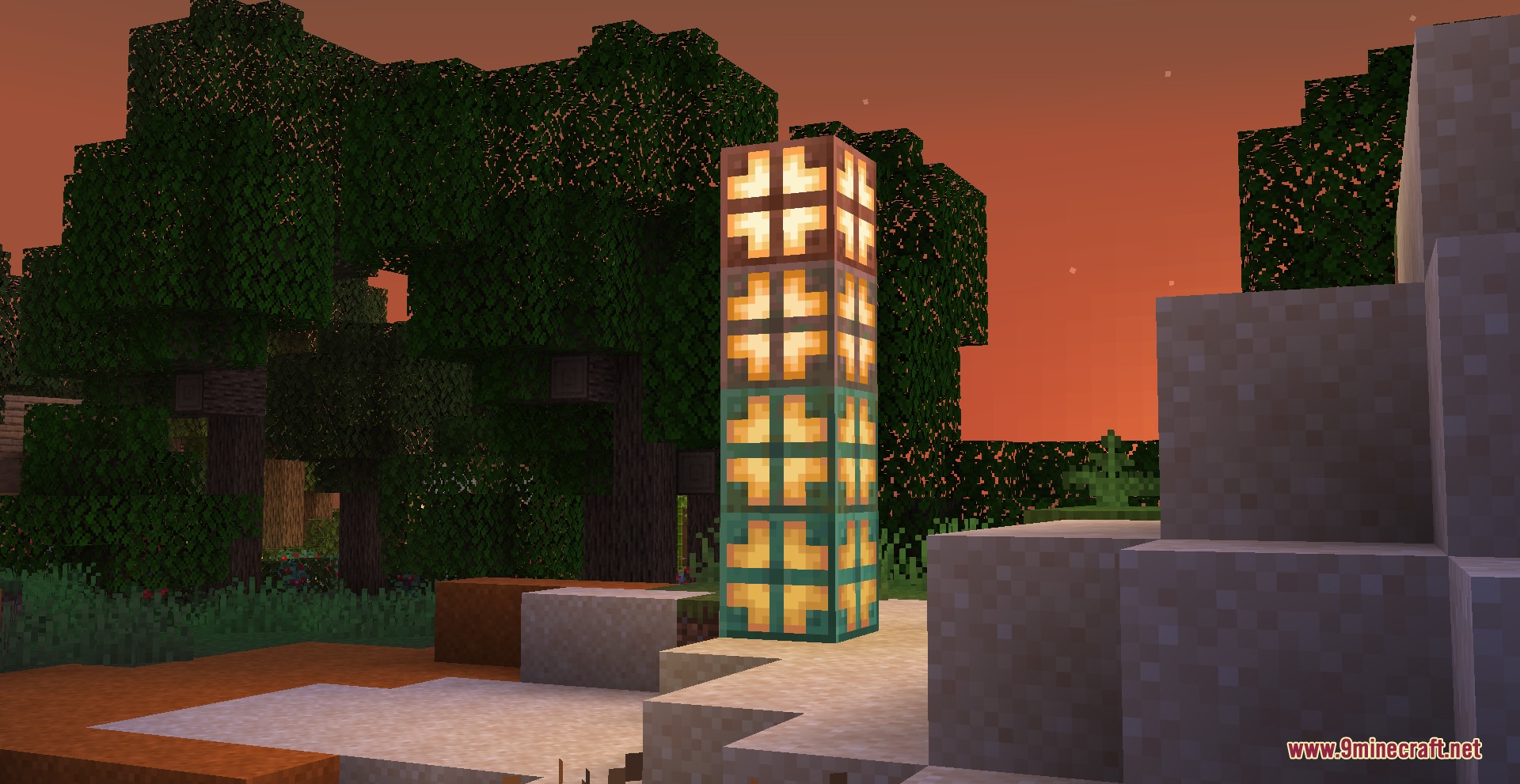 Stacked copper bulbs emitting light in a forest during the sunset hours