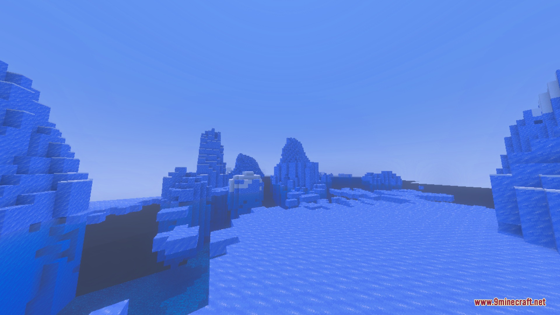 Glowing Ores Plus Shader Screenshot 3 Towering blue ice spikes scattered across a frozen ocean in Minecraft