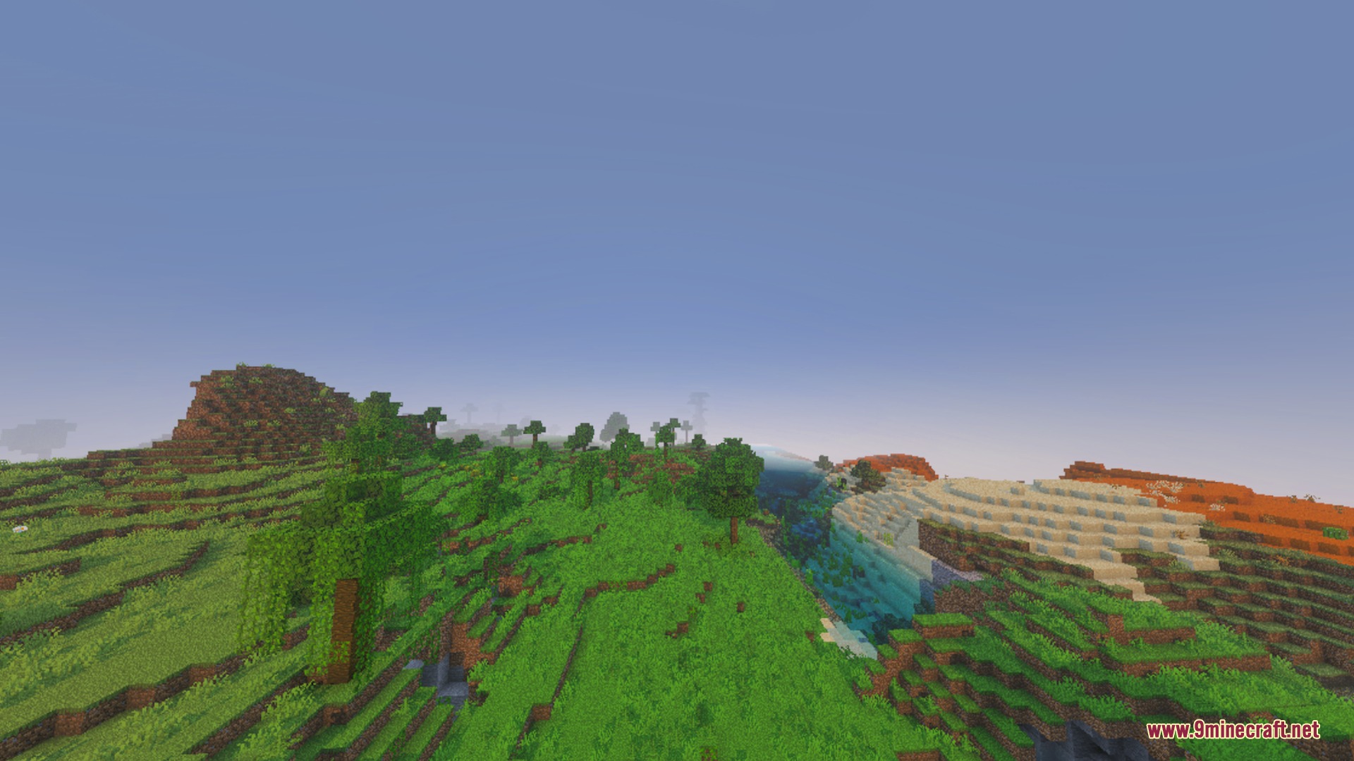 Glowing Ores Plus Shader Screenshot 9 A wide Minecraft landscape showing green hills transitioning into a sandy desert biome