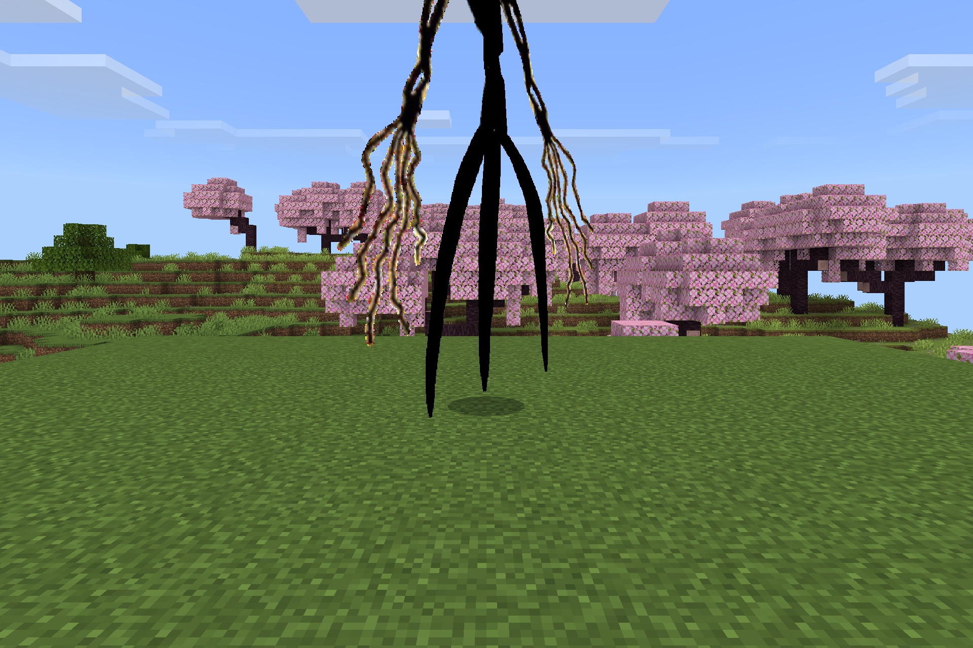 Goat Stalker Addon Screenshot 2 A towering black beast with long limbs stands in a Minecraft cherry grove