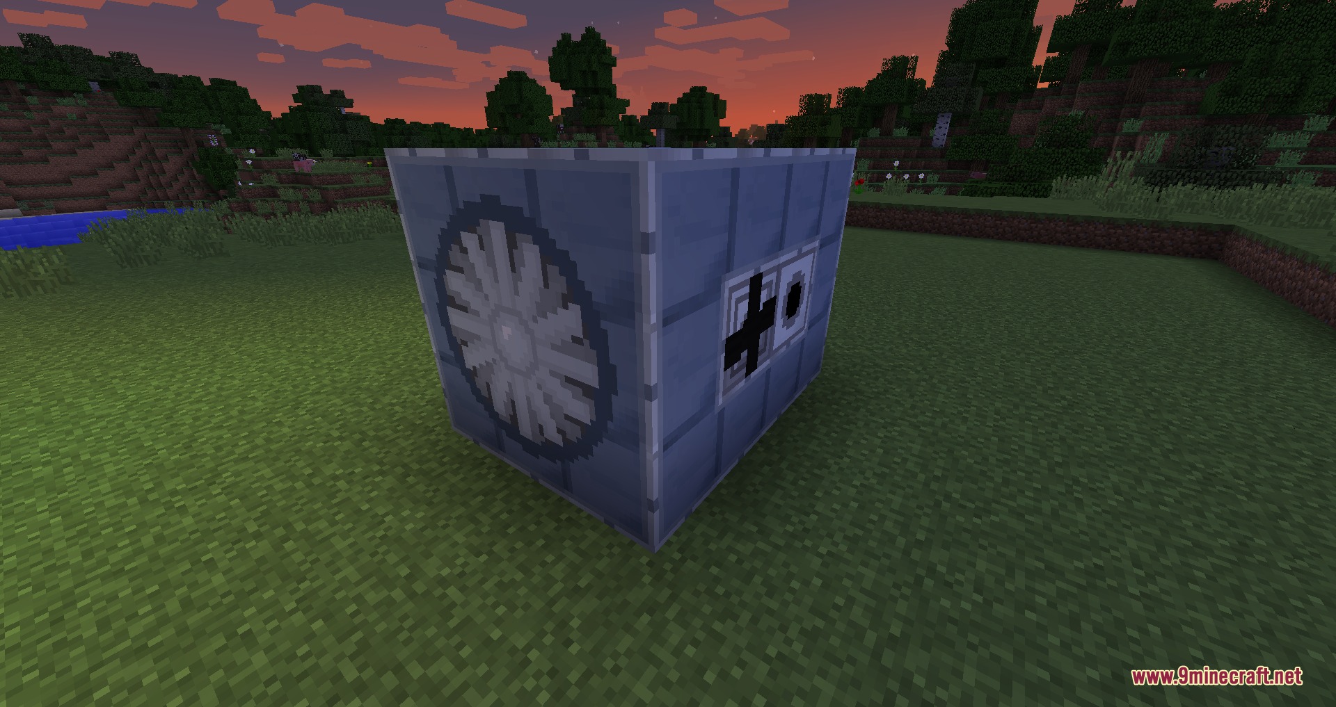 A compact multiblock turbine structure made of grey blocks on the grass
