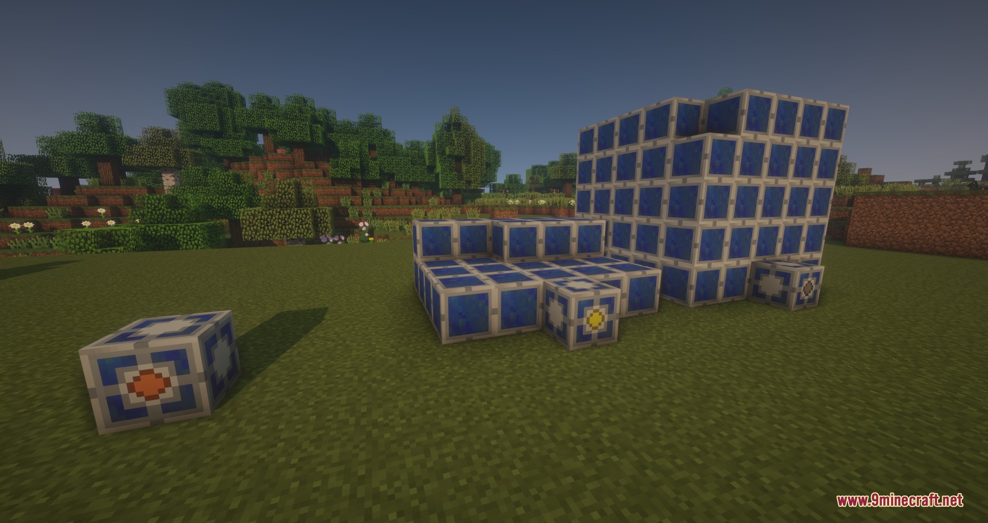 Large blue multiblock structures from GregTech Experimental placed in a grassy field