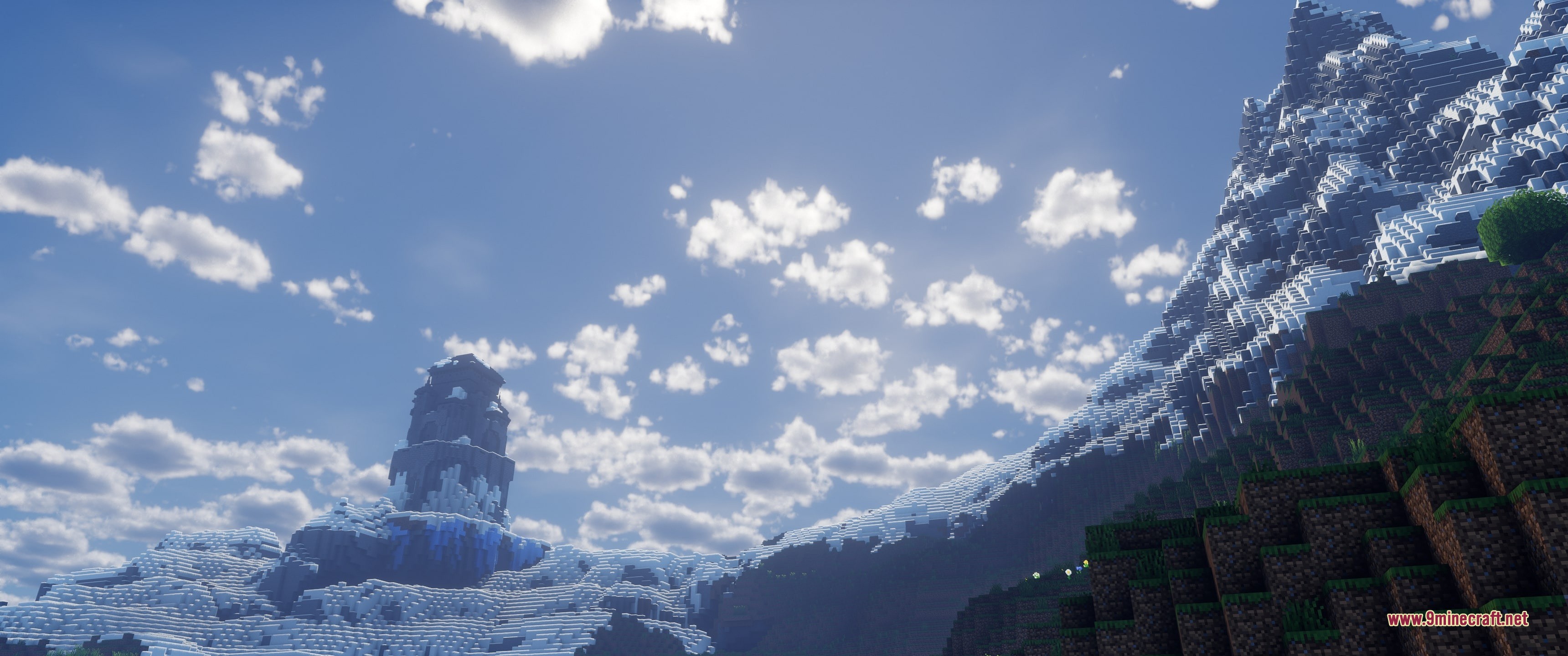Grim Kingdoms Structures & Ruins Data Pack Screenshot 6 A stone tower overlooks a snowy mountain range under a bright blue sky