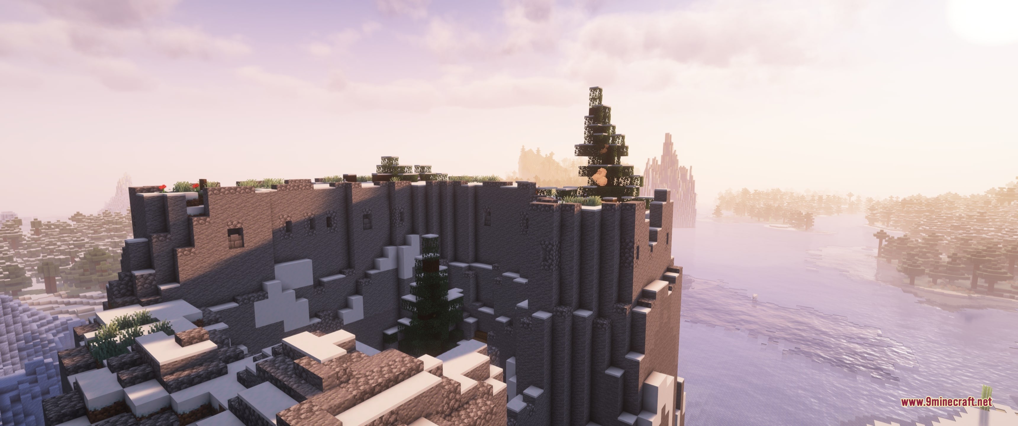 Grim Kingdoms Structures & Ruins Data Pack Screenshot 9 A dark stone Grim Kingdoms fortress overlooking a river in a snowy biome