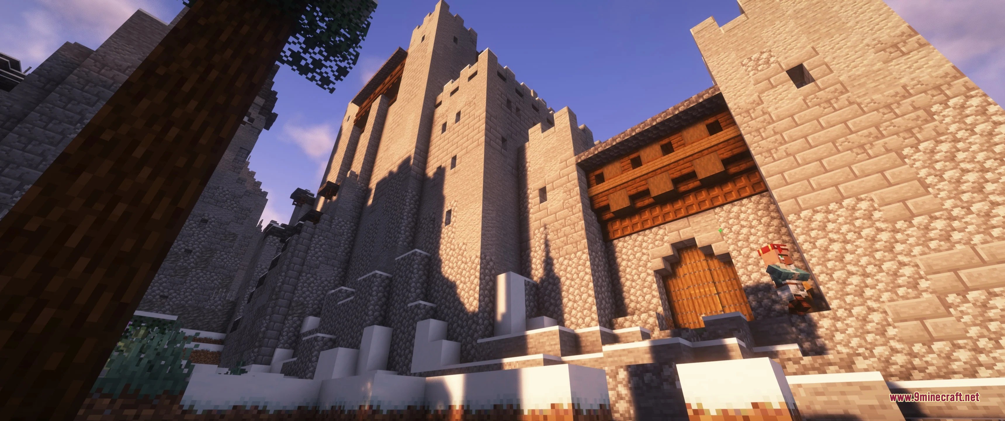 Grim Kingdoms Vanilla Edition Data Pack Screenshot 4 A massive stone castle with wooden gates and towers in a snowy biome