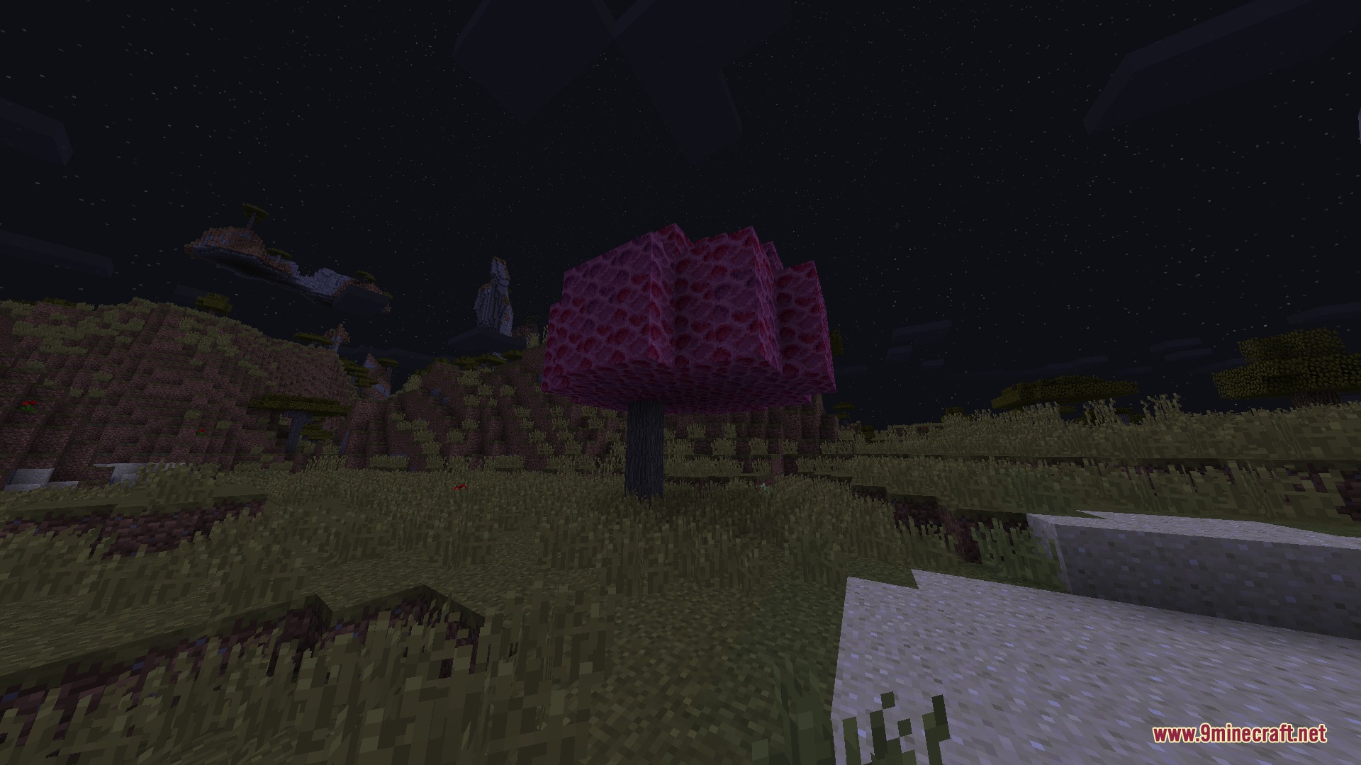 HBM's NTM Nuclear Tech Reforged Mod Screenshot 1 A vibrant purple tree grows in a dark grassy field during nighttime