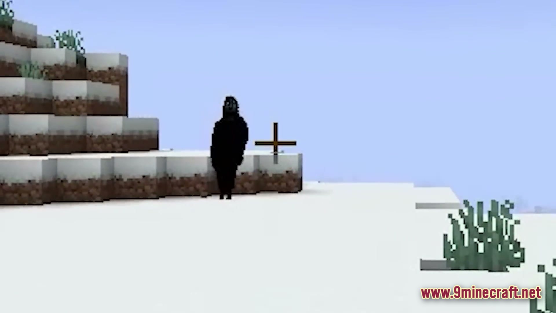HORROR Modpack Screenshot 4 A dark, shadowy figure stands on a snowy hillside within a Minecraft winter biome