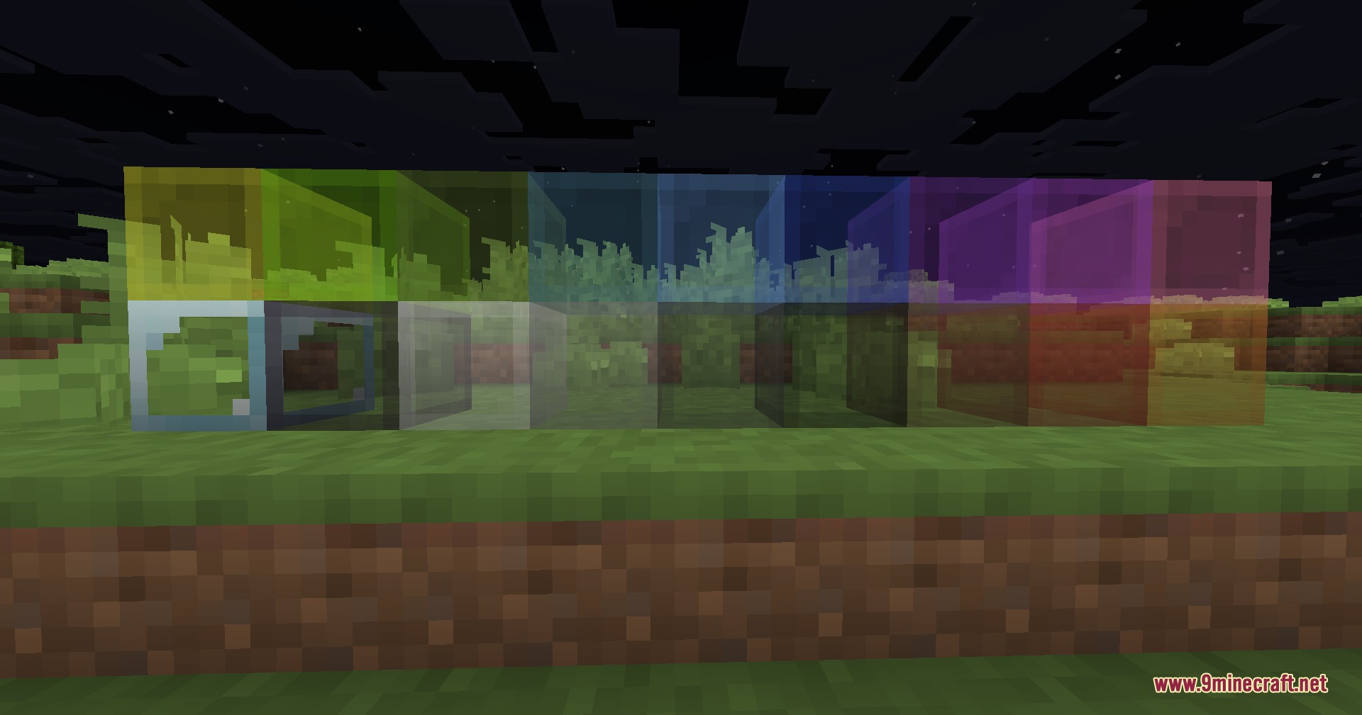 A row of colorful stained glass blocks with shrunk textures on grass