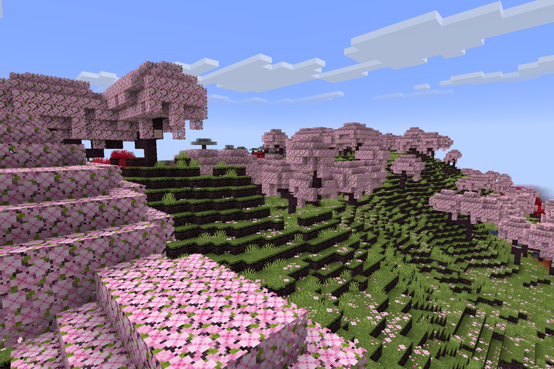 Hazbin Hotel + Helluva Boss Pack Resource Pack Screenshot 1 Pink cherry blossom trees covering a green hillside in a Sloth cherry grove