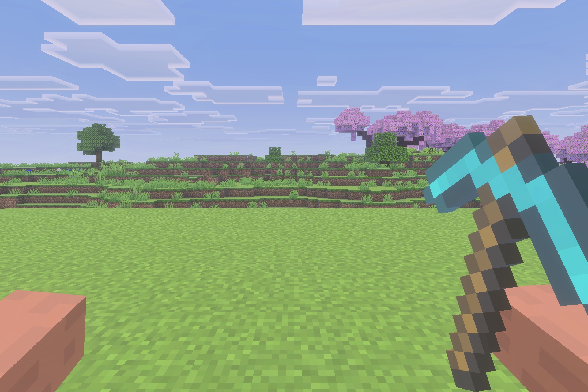 A player holding a diamond pickaxe while looking at a cherry blossom forest