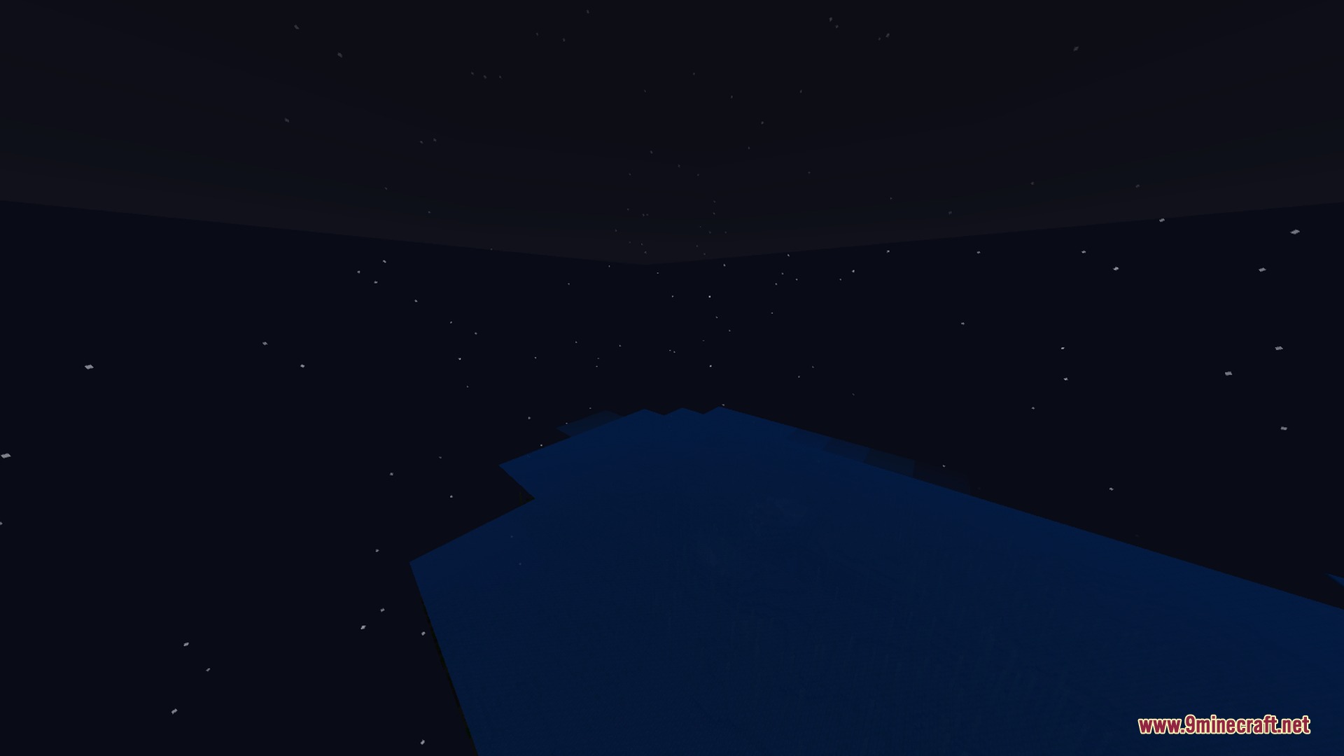 A beautiful starry night sky above the dark water of the ocean