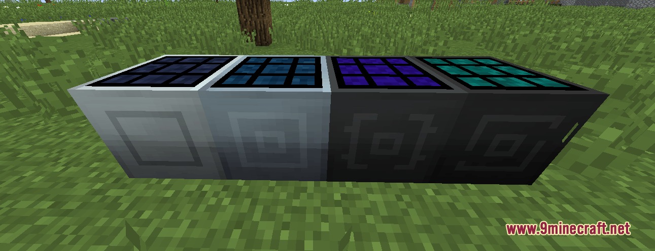 Four different solar panel blocks placed in a row on green grass
