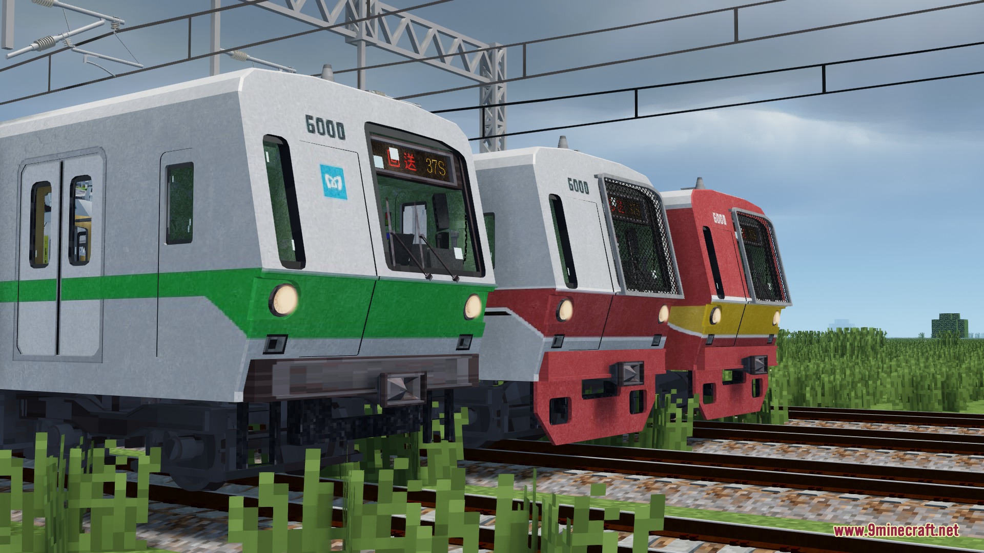 IR DE Ket's Global Train Pack for Immersive Railroading Resource Pack Screenshot 3 Three colorful metro trains parked on tracks under overhead wires in Minecraft