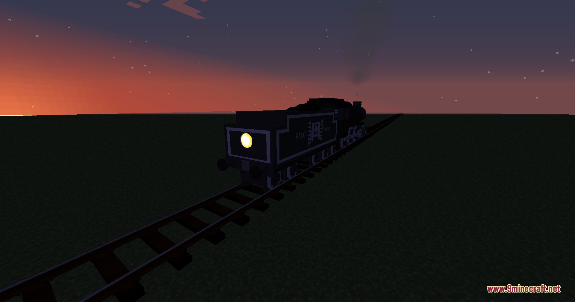 Rear view of a steam train moving along tracks during a sunset