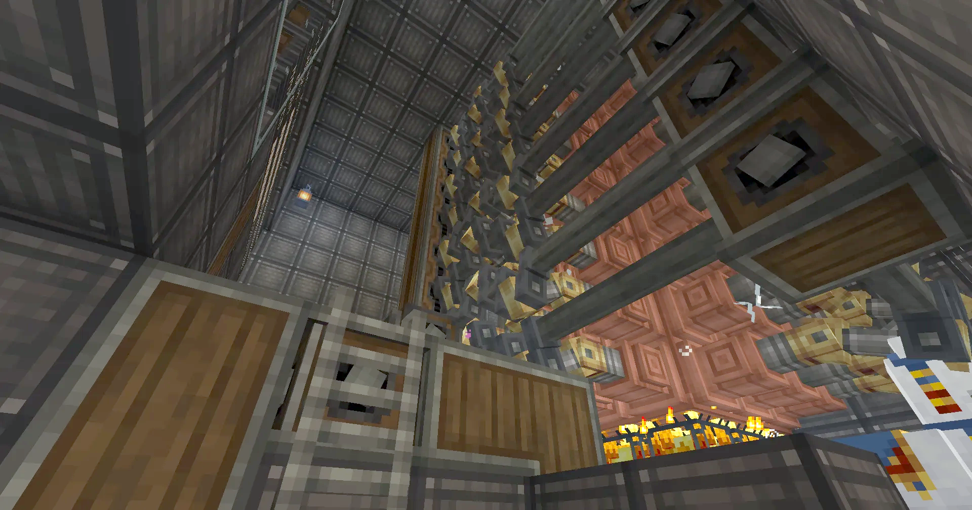 Intricate network of copper pipes and gears inside a large mechanical structure