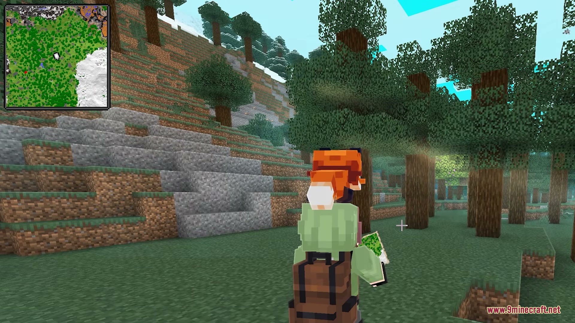 Immersive Minimaps Mod Screenshot 6 A player holding a map in a forest with a minimap interface