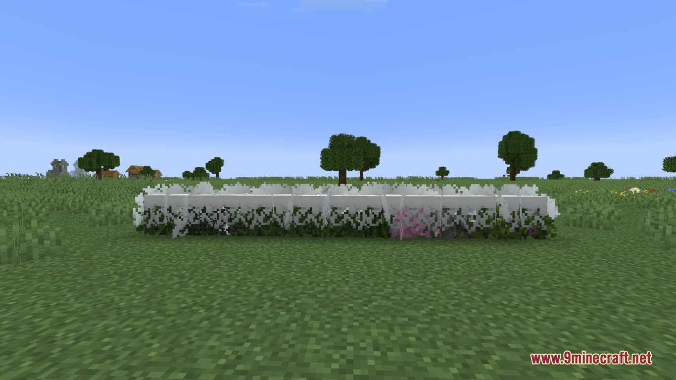 Showcasing various bushy leaf blocks with snow layers on a grassy field