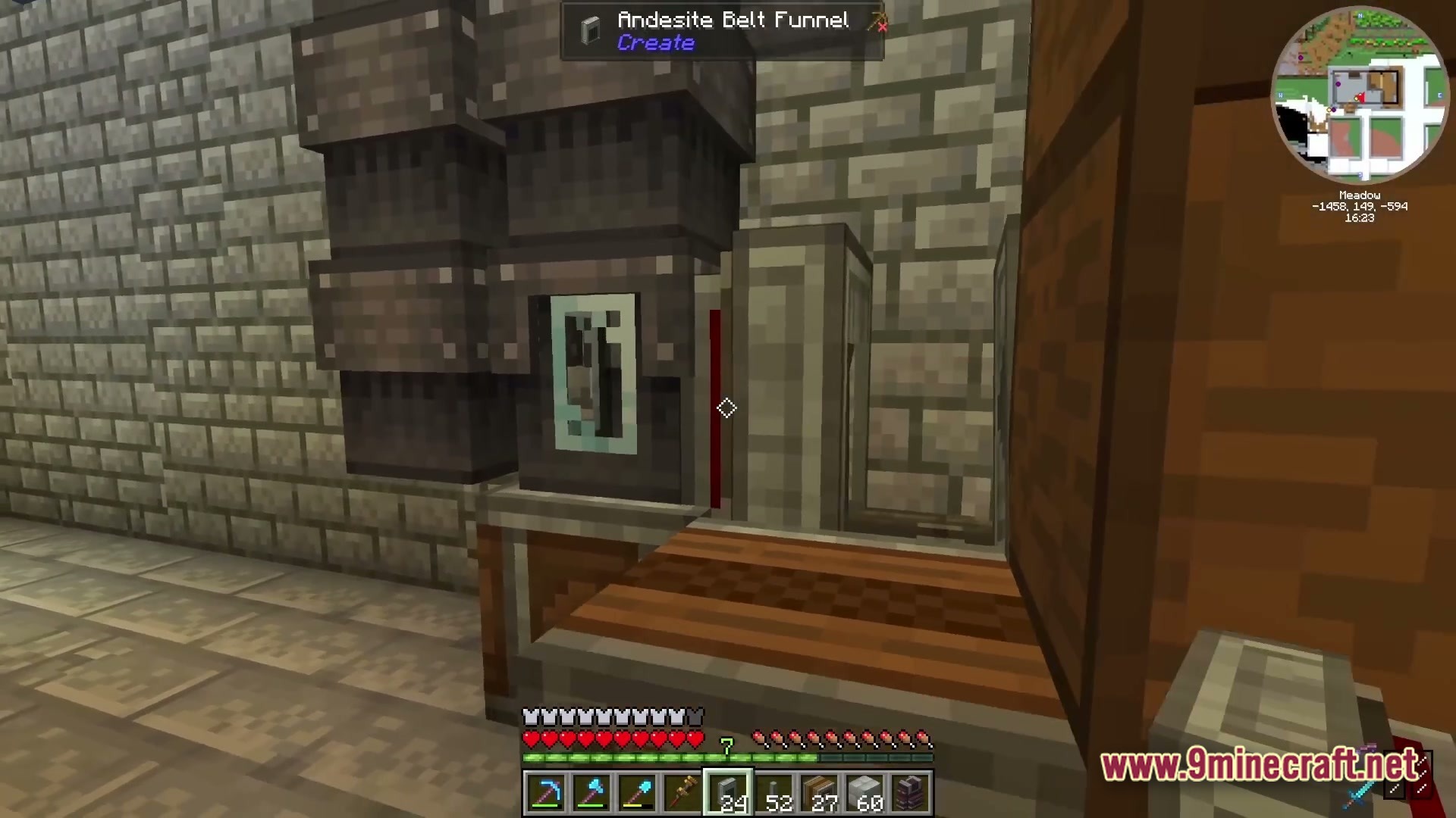 Industrial Banquet Crucible Modpack Screenshot 2 An Andesite Belt Funnel from the Create mod positioned above a wooden mechanical belt system