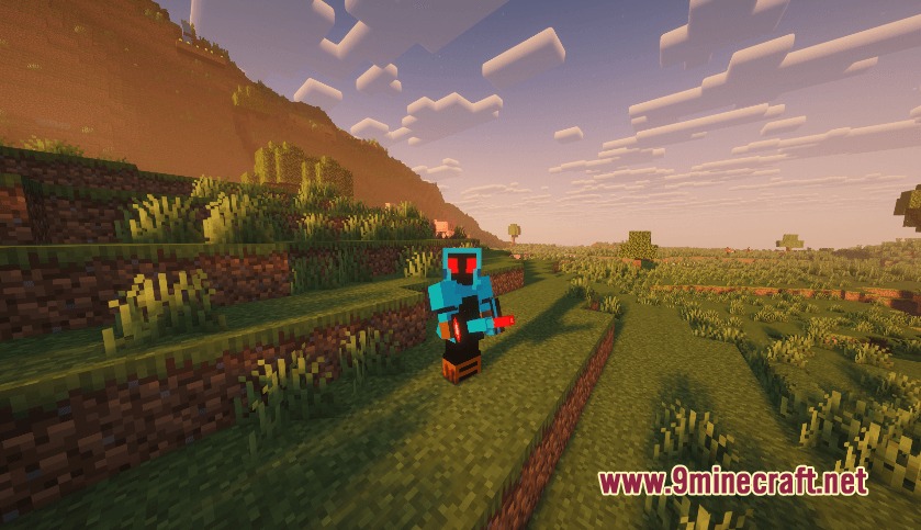 Player character in blue armor holding a powerful red weapon during sunset
