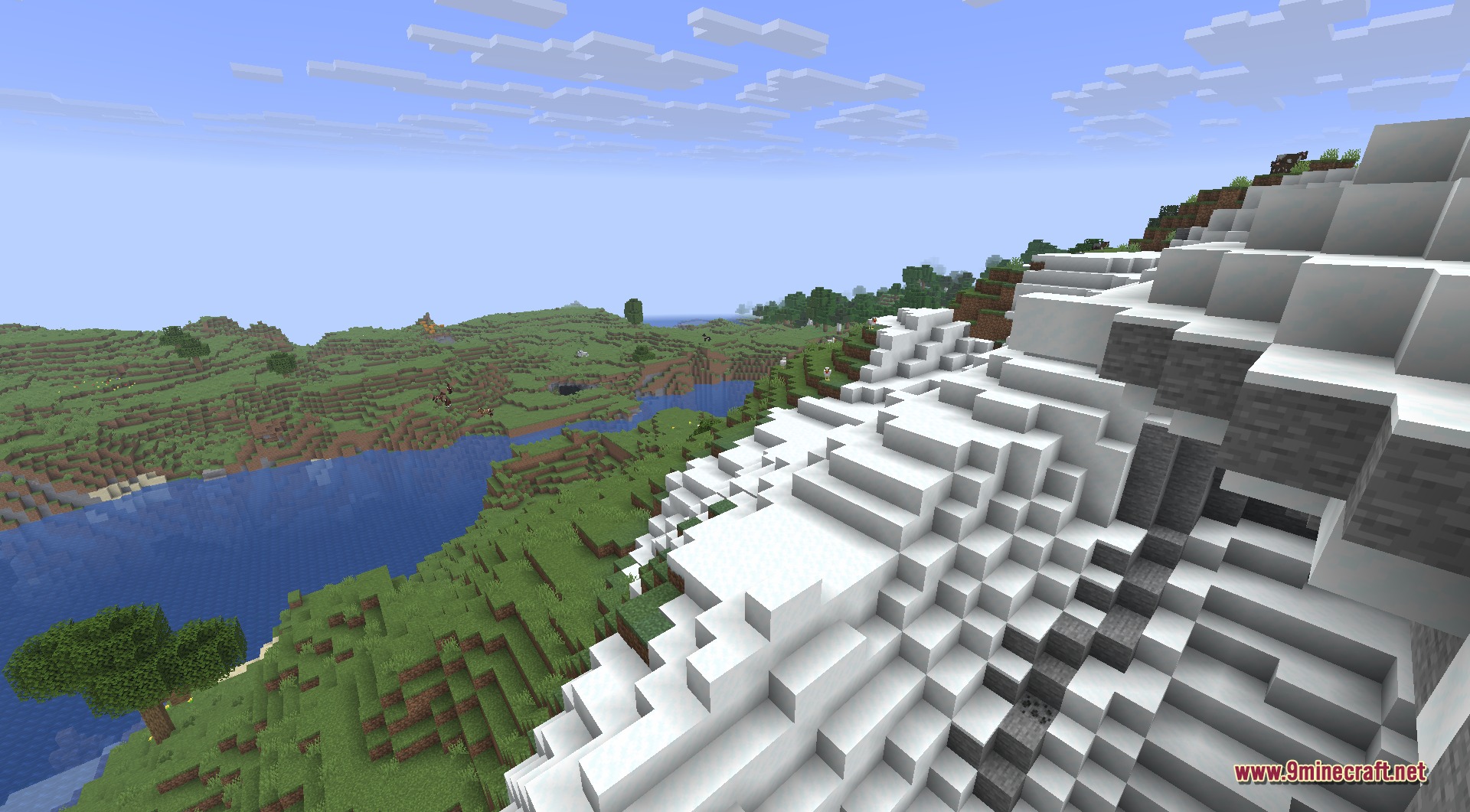 Infinite Music 9minecraft Mod Screenshot 3 Snowy mountain peak overlooking a lush green valley and a blue river