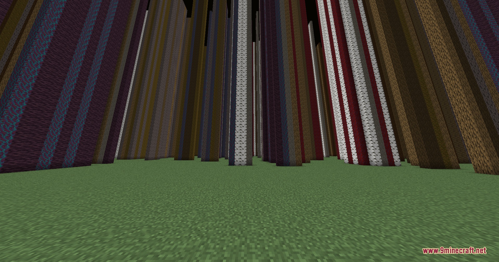 Infinite Yellow Descent Mod Screenshot 6 Endless vertical columns of various materials rising from a flat green grass field