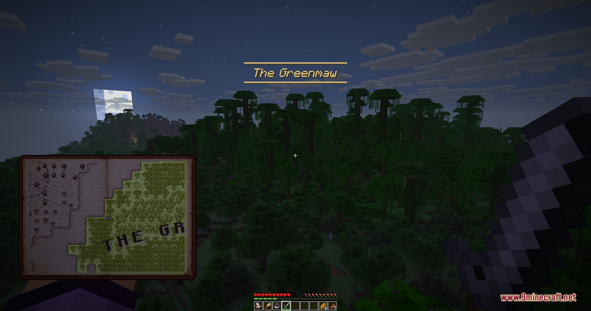 A player holds a hand drawn map book while exploring the Greenmaw jungle