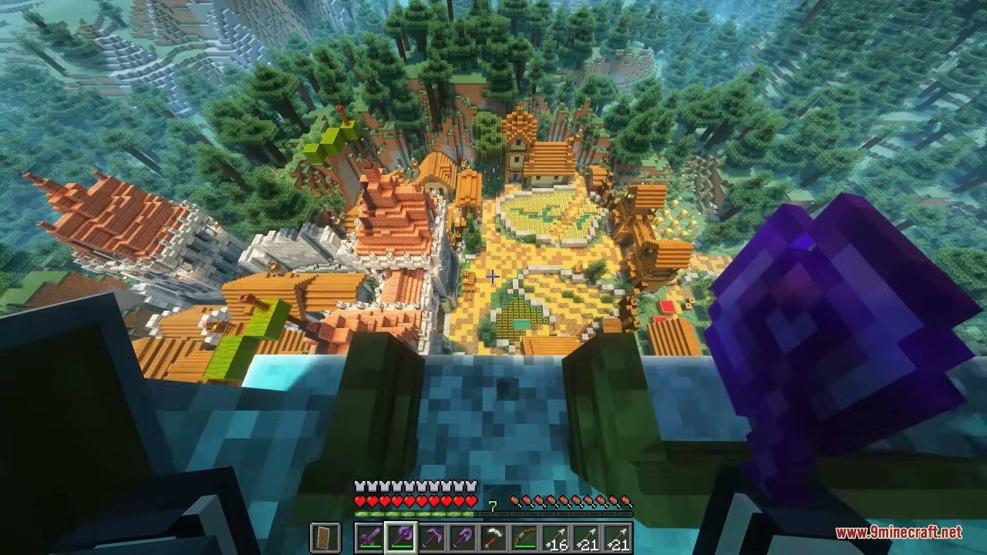 A player looking down at a village from a high balcony in Minecraft