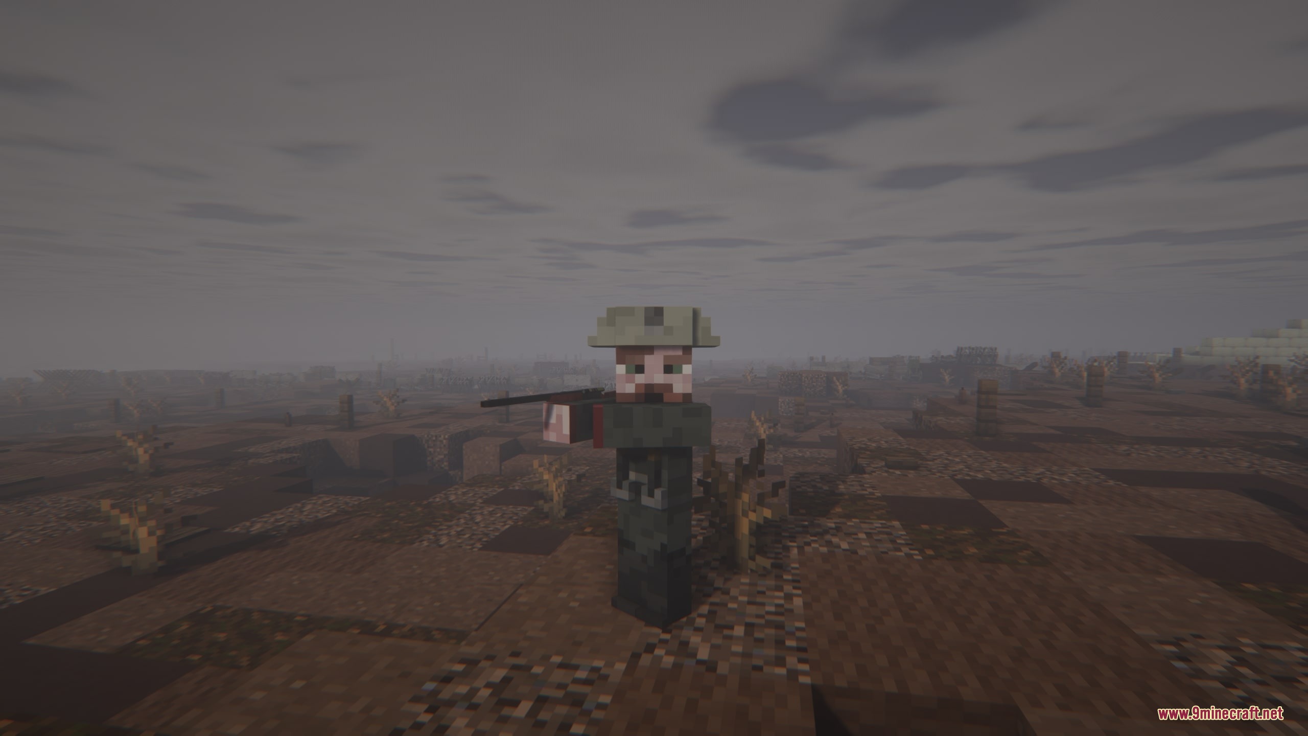 Iron Trenchline Mod Screenshot 2 A soldier aims a vintage rifle across a desolate and muddy war zone