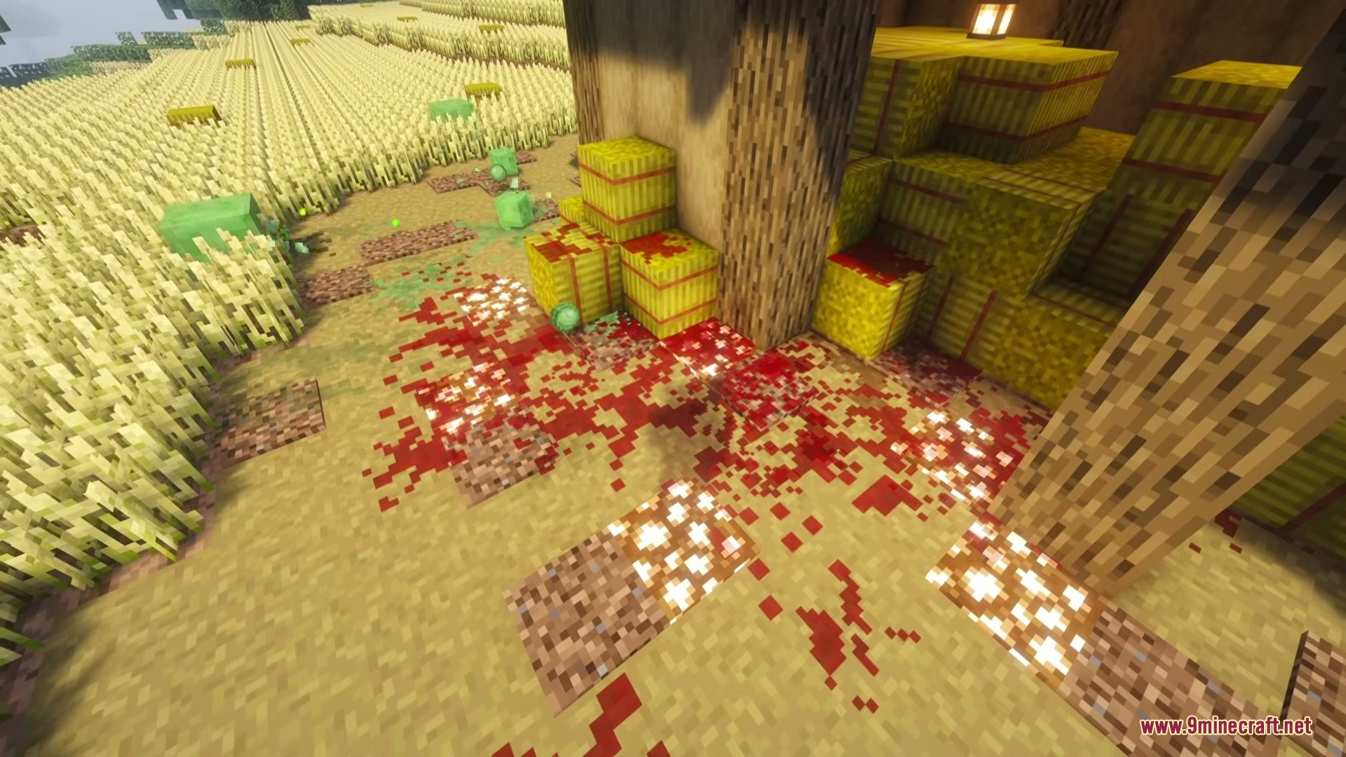 Iron's Simple Blood Mod Screenshot 5 Red blood stains on the ground and hay bales near a wheat field