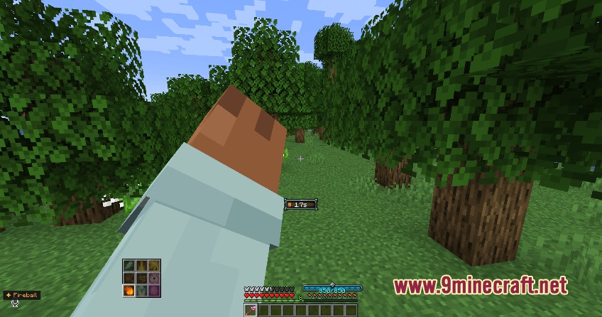 Player holding a magic staff with a spell selection menu on screen