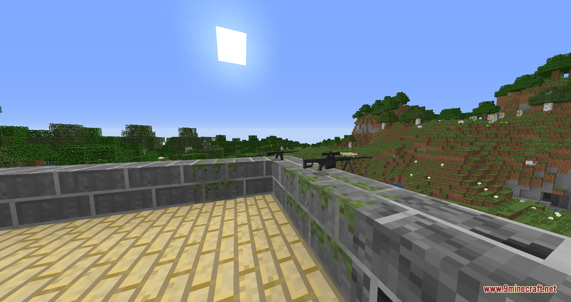 Ironworks Ballistics Mod Screenshot 1 Two sniper rifles rest on a stone wall overlooking a green landscape