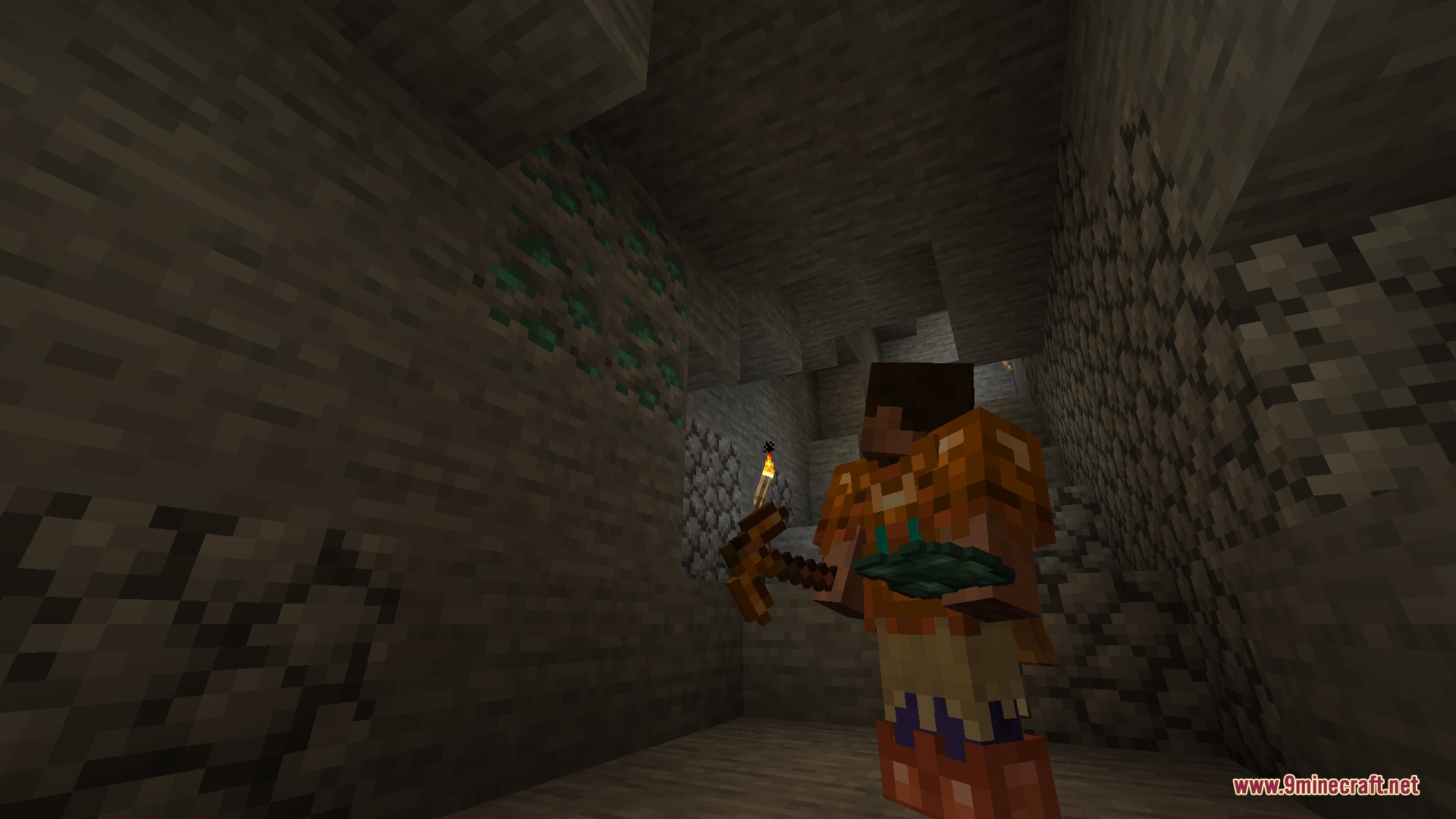 JMG's Better Than Ever BTE Mod Screenshot 6 Character holding a pickaxe and torch while inspecting green copper ore blocks