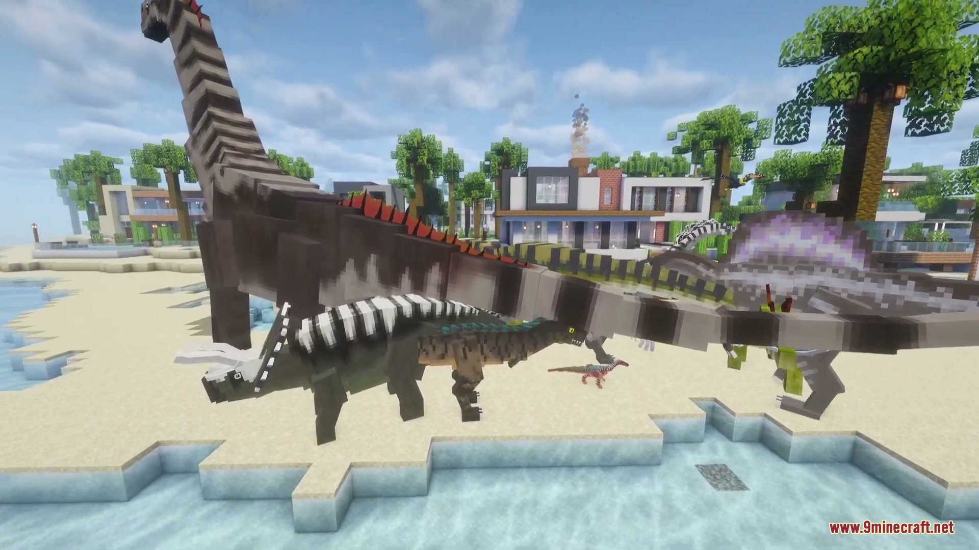 Jurassic Revived Mod Screenshot 5 Several different dinosaur species standing on a sandy beach near modern houses