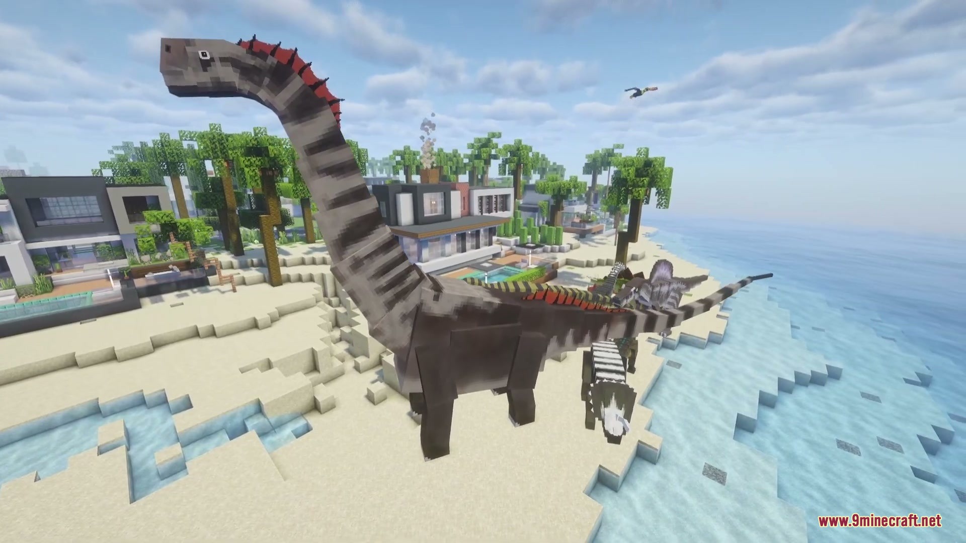 Jurassic Revived Mod Screenshot 6 A giant Brachiosaurus towers over the beach next to a modern villa