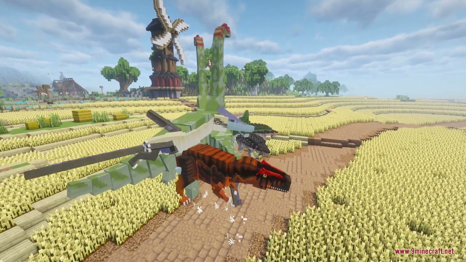 Jurassic Revived Mod Screenshot 7 Various dinosaurs from Jurassic Revived Mod roaming through a golden wheat field