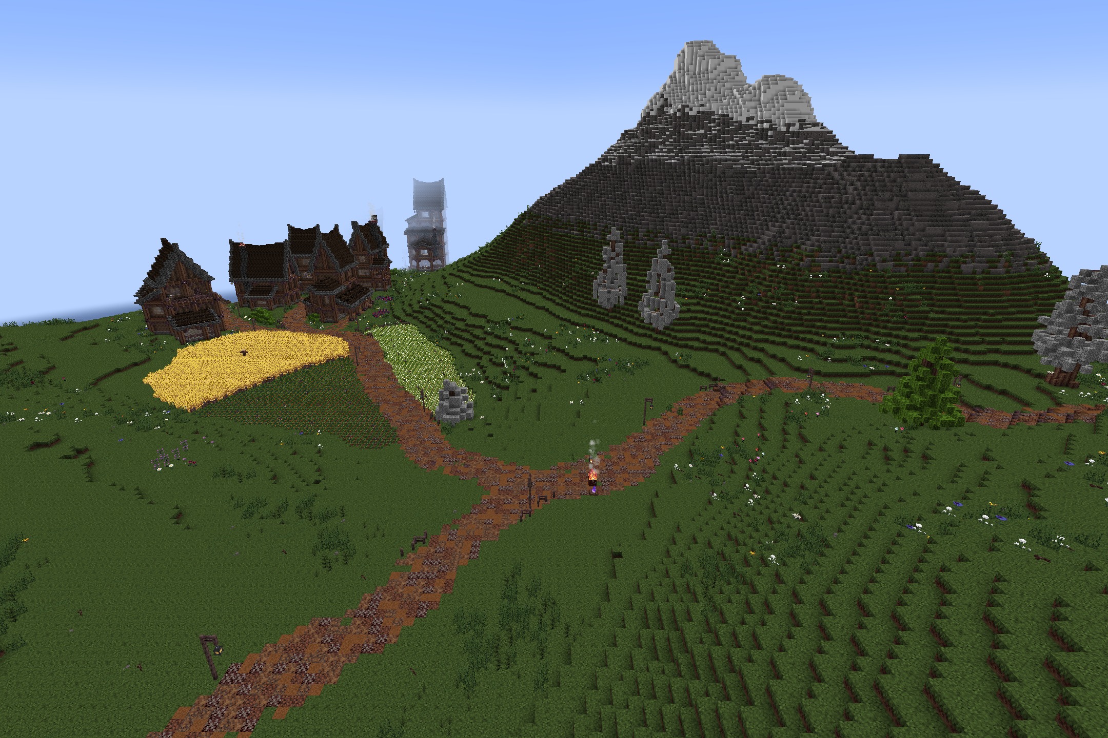 KDCraft~Fantastic Journey Resource Pack Screenshot 6 Medieval houses and crop fields sit at the base of a tall mountain