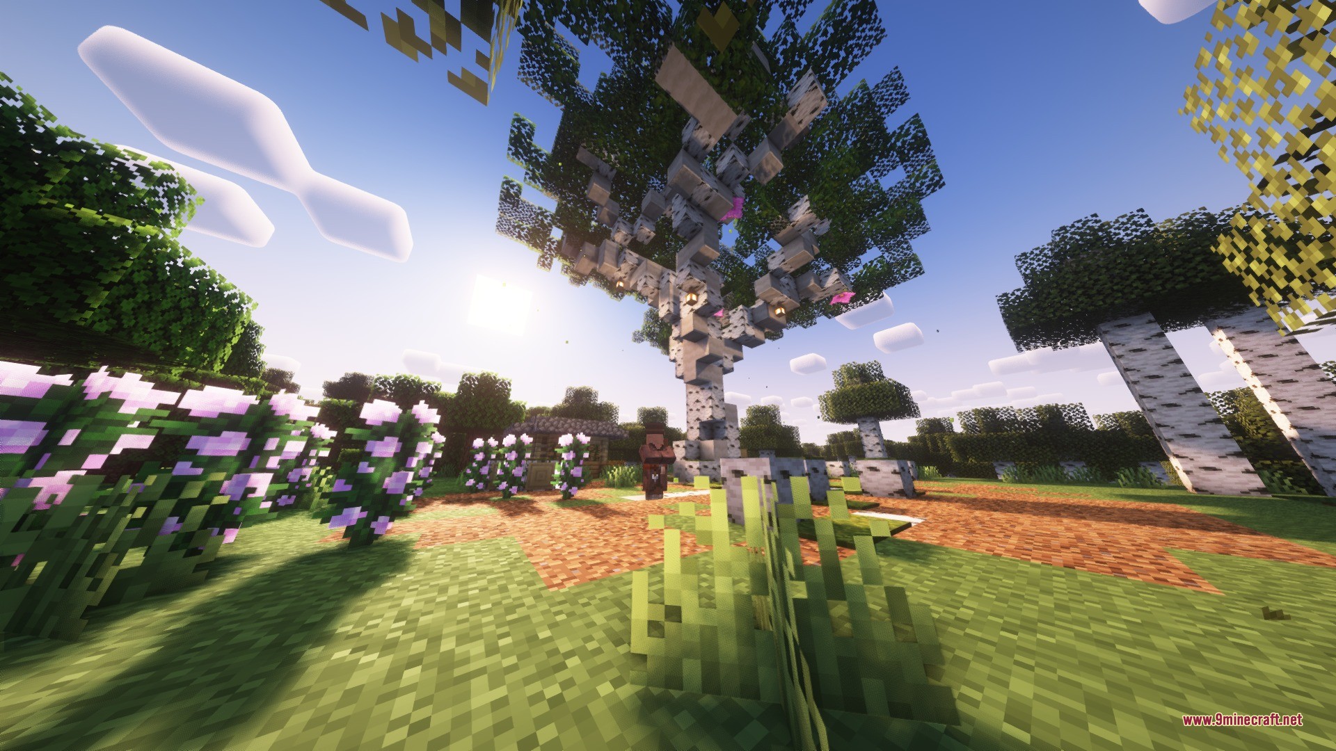 Katters Structures Ambient Data Pack Screenshot 2 A massive custom birch tree with lanterns stands in a lush flower garden