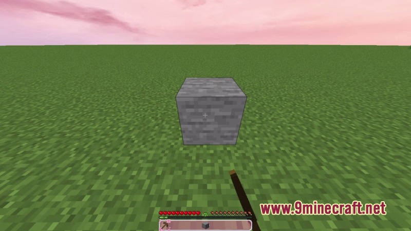 Kawaii PvP Resource Pack Screenshot 5 A stone block on green grass under a soft pink sky with custom UI
