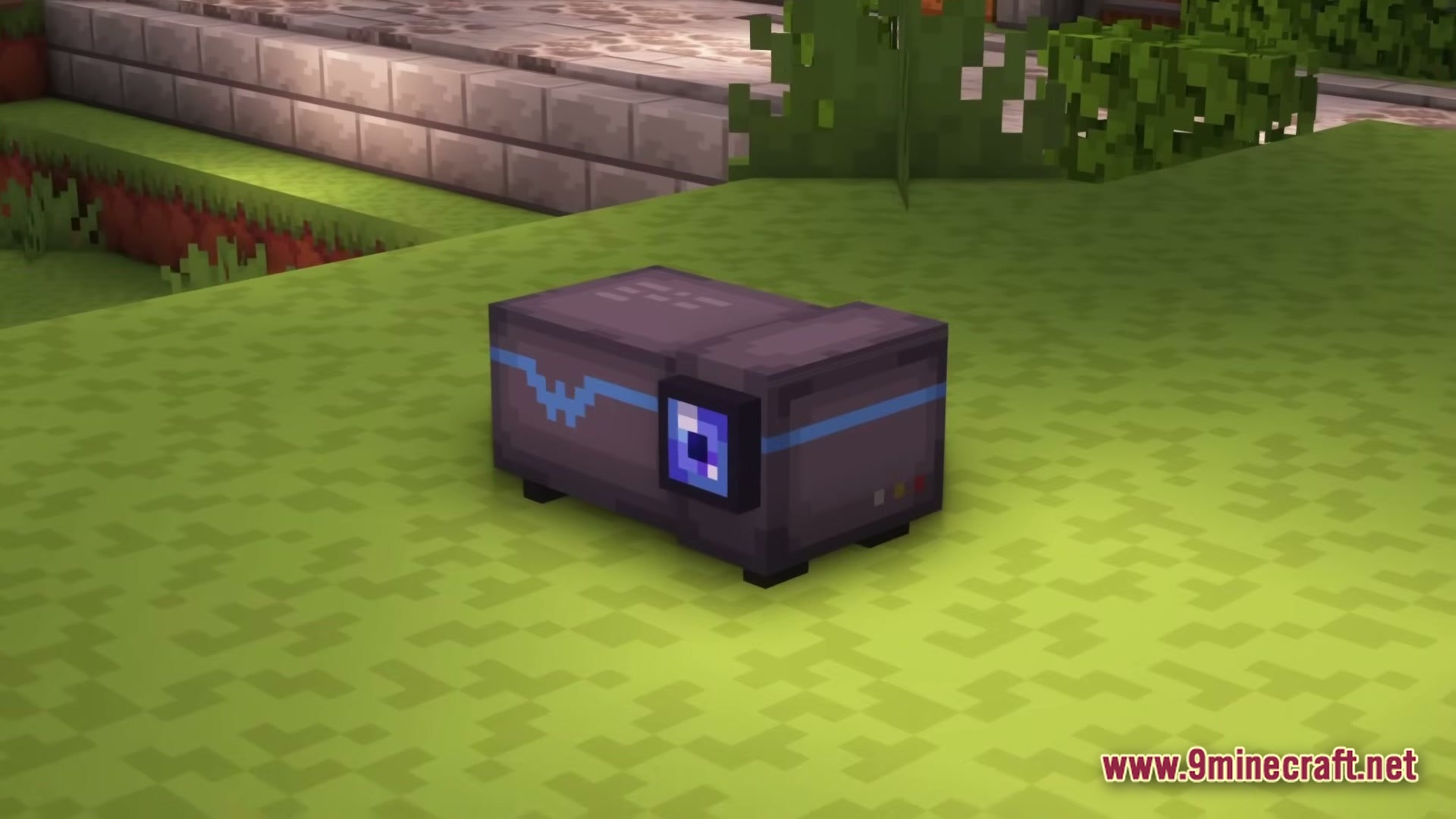 LOVERNITE ADVENTURE 1 Modpack Screenshot 3 A small grey electronic machine with a blue screen sits on a grassy field