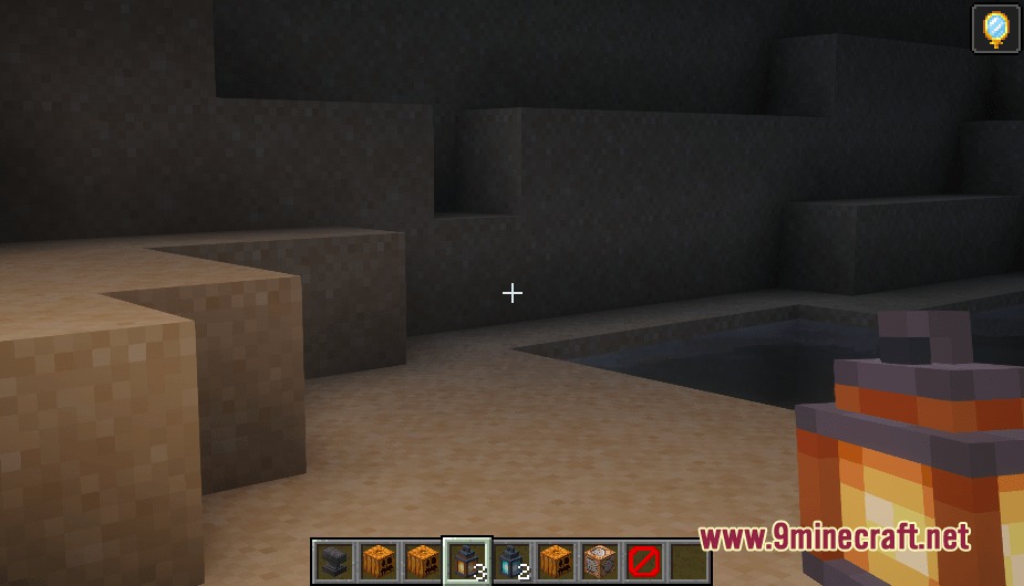 A player holding a detailed 3D lantern while exploring a dark cave