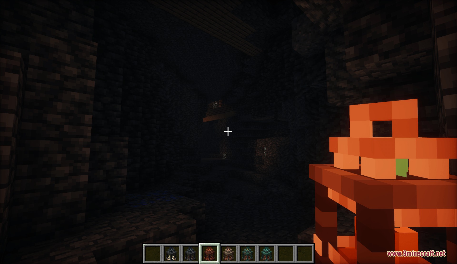 Lanterns with Candles Resource Pack Screenshot 4 Player holding a glowing copper lantern while exploring a dark underground cave