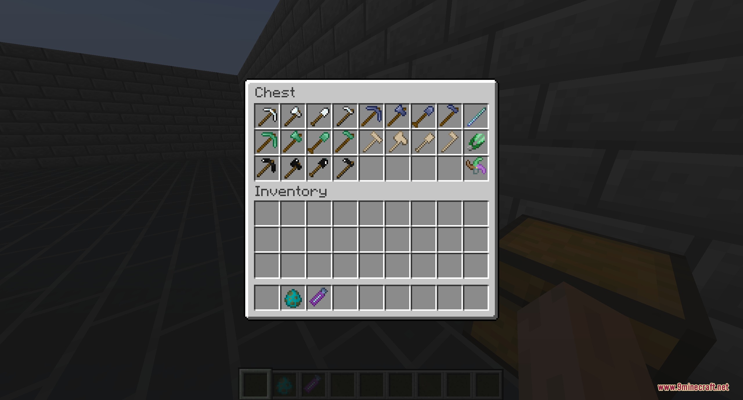 Latawoo's Extra Tools Ores and Weapons Mod Screenshot 6 A chest filled with various colorful tools and equipment in a Minecraft world