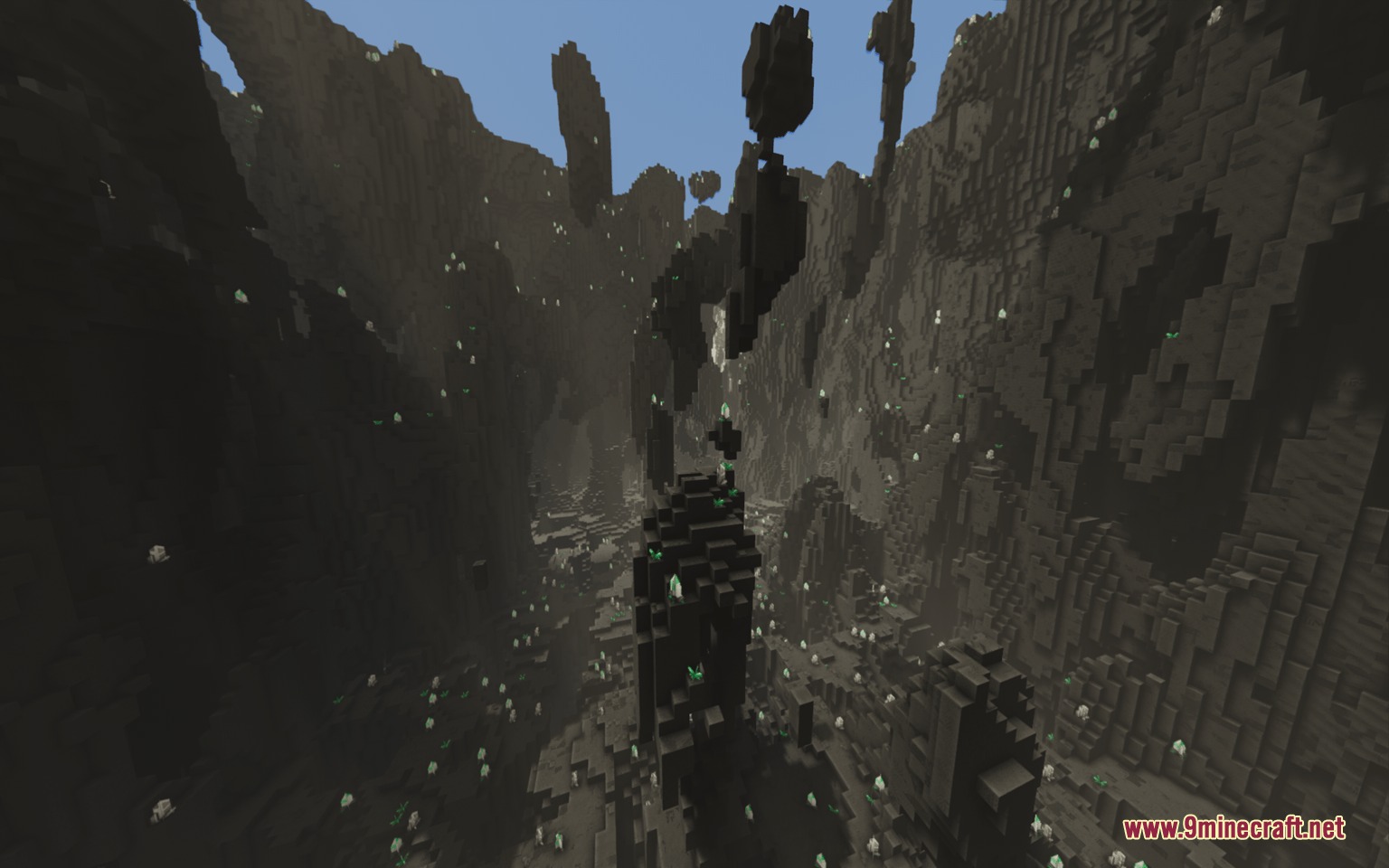 Latex Caves Mod Screenshot 2 Dark pillars and glowing green spots inside a shadowy underground latex cavern